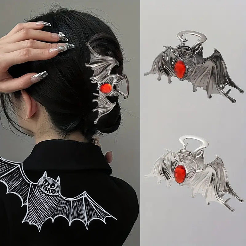 A woman wearing the stylish Halloween bat hair clip to showcase its size and look.