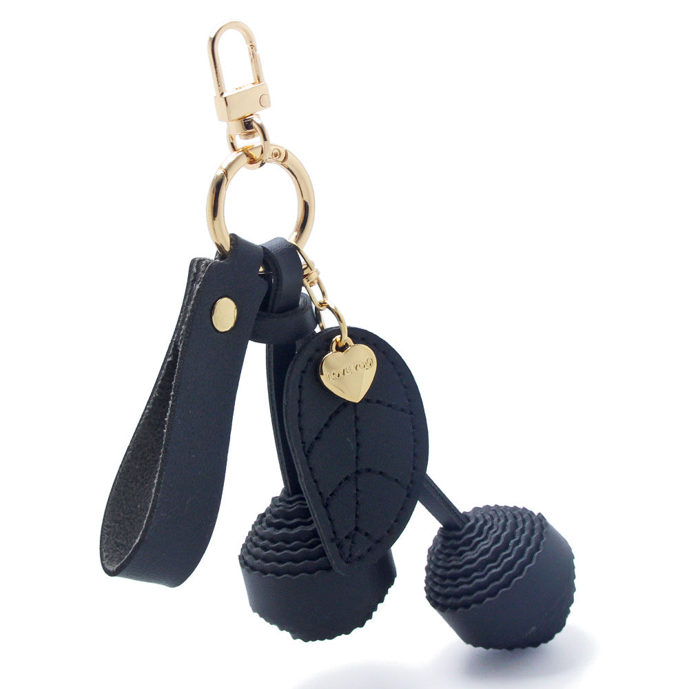 Black PU leather cherry keychain with gold hardware