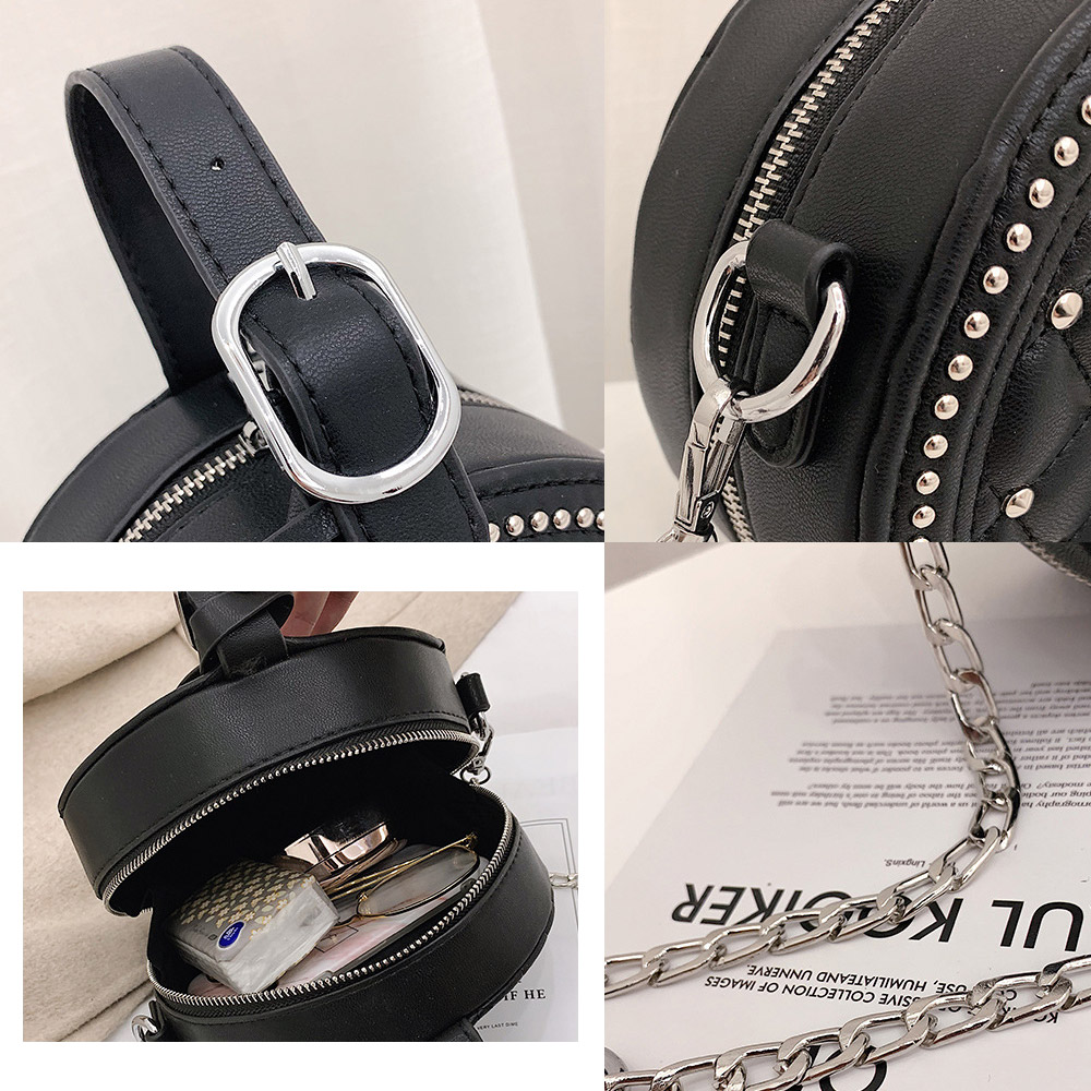 Detailed view of the black PU leather handbag with silver hardware and chain strap