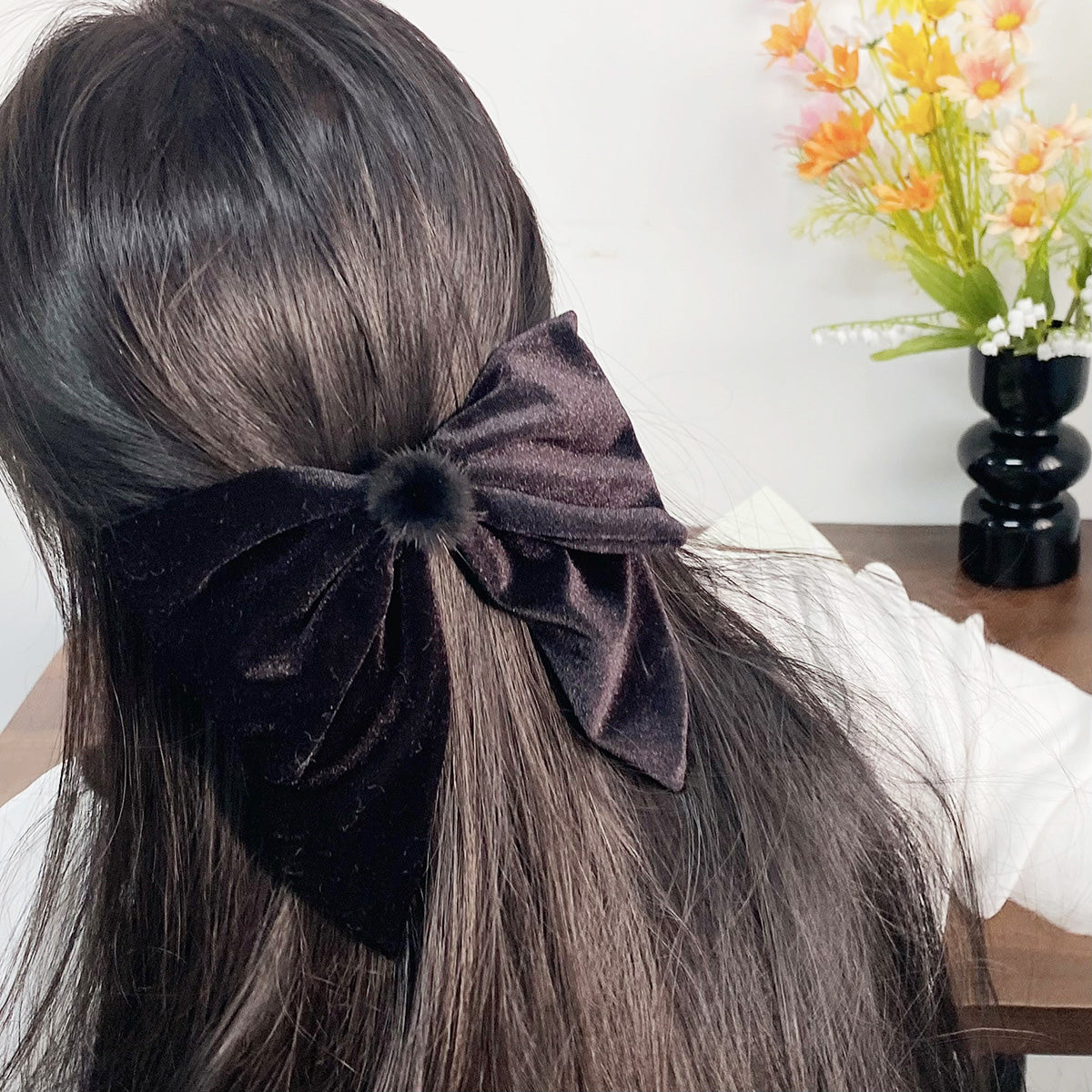 Model wearing the black velvet bowknot hair clip