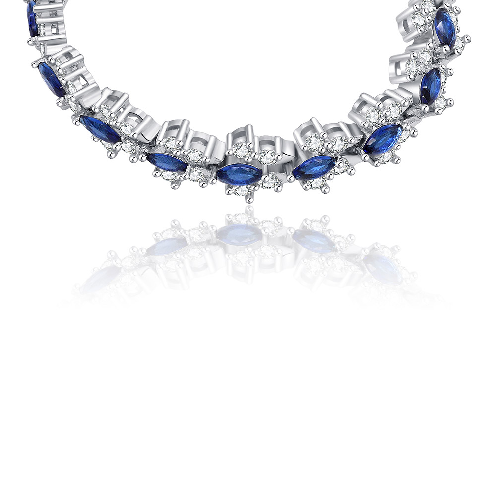 A perspective shot highlighting the sparkle of the blue and clear gemstones on the Tennis Montana Tear Bracelet.