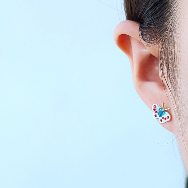 Model wearing a vintage enamel butterfly stud earring