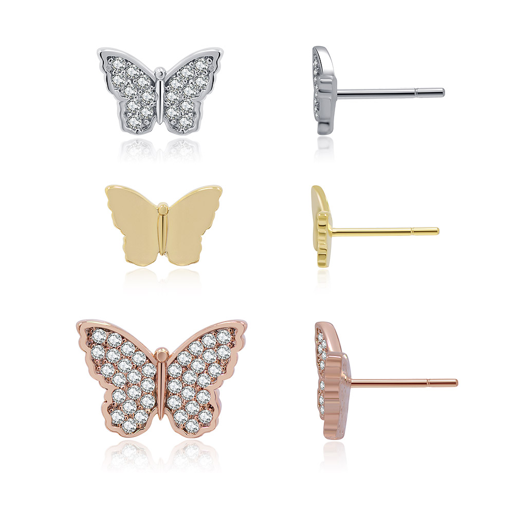 A close-up of the three pairs of butterfly earrings in silver, gold, and rose gold