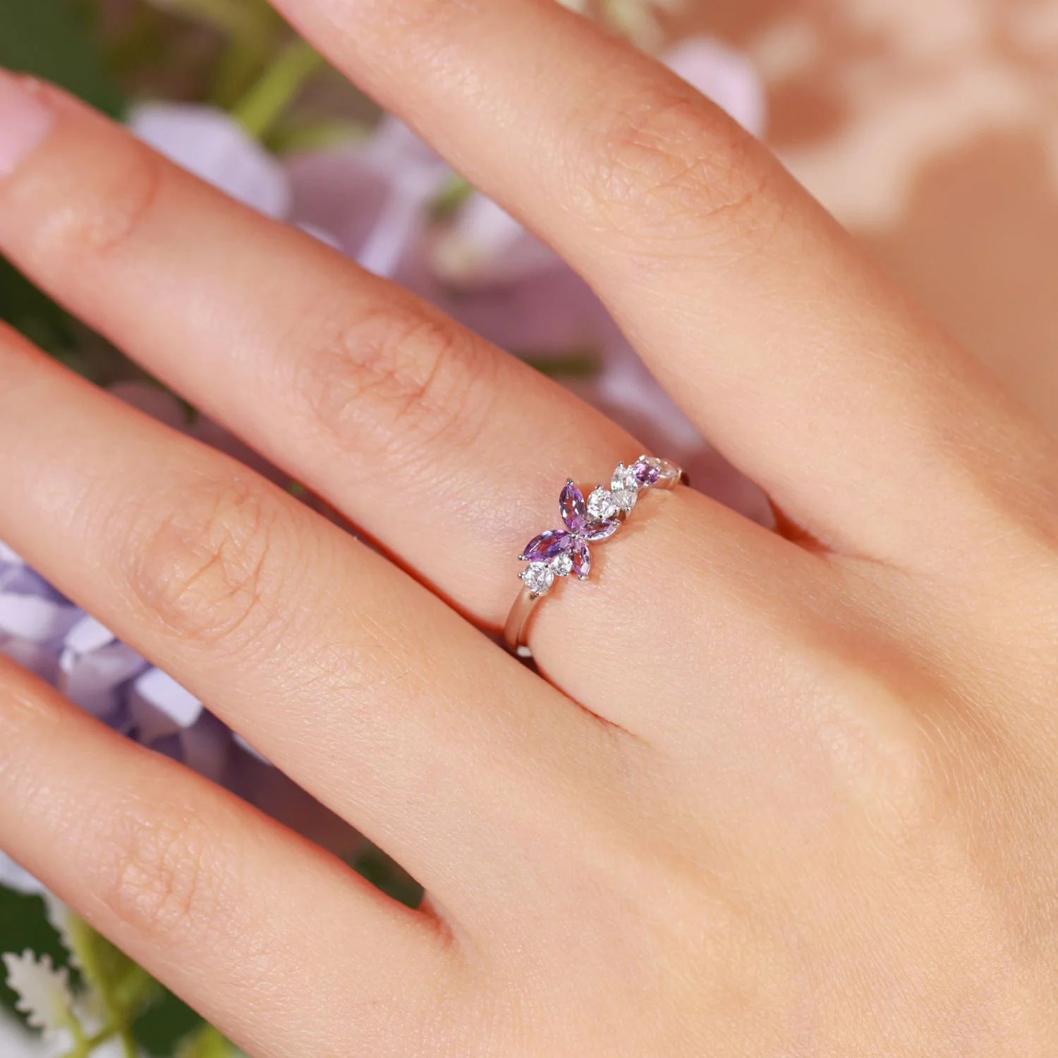 A model wearing the Amethyst Butterfly Ring to showcase its elegant fit.