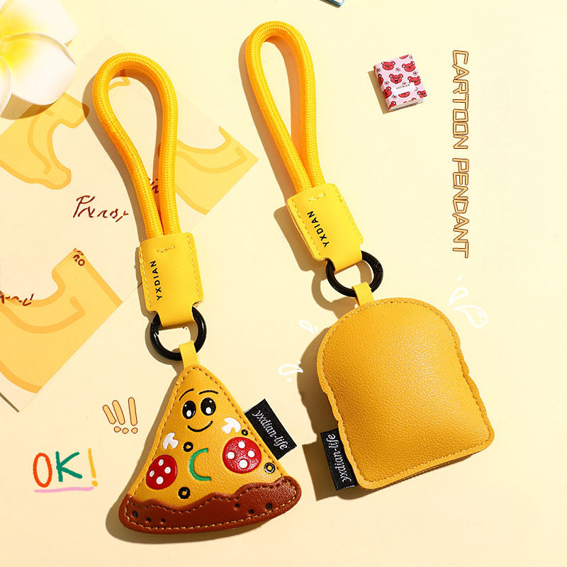 Cartoon pizza keychain attached to a black pouch