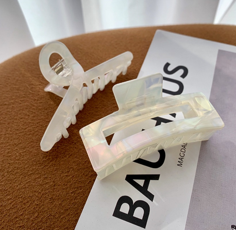Close-up of clear acetate hair claw clips