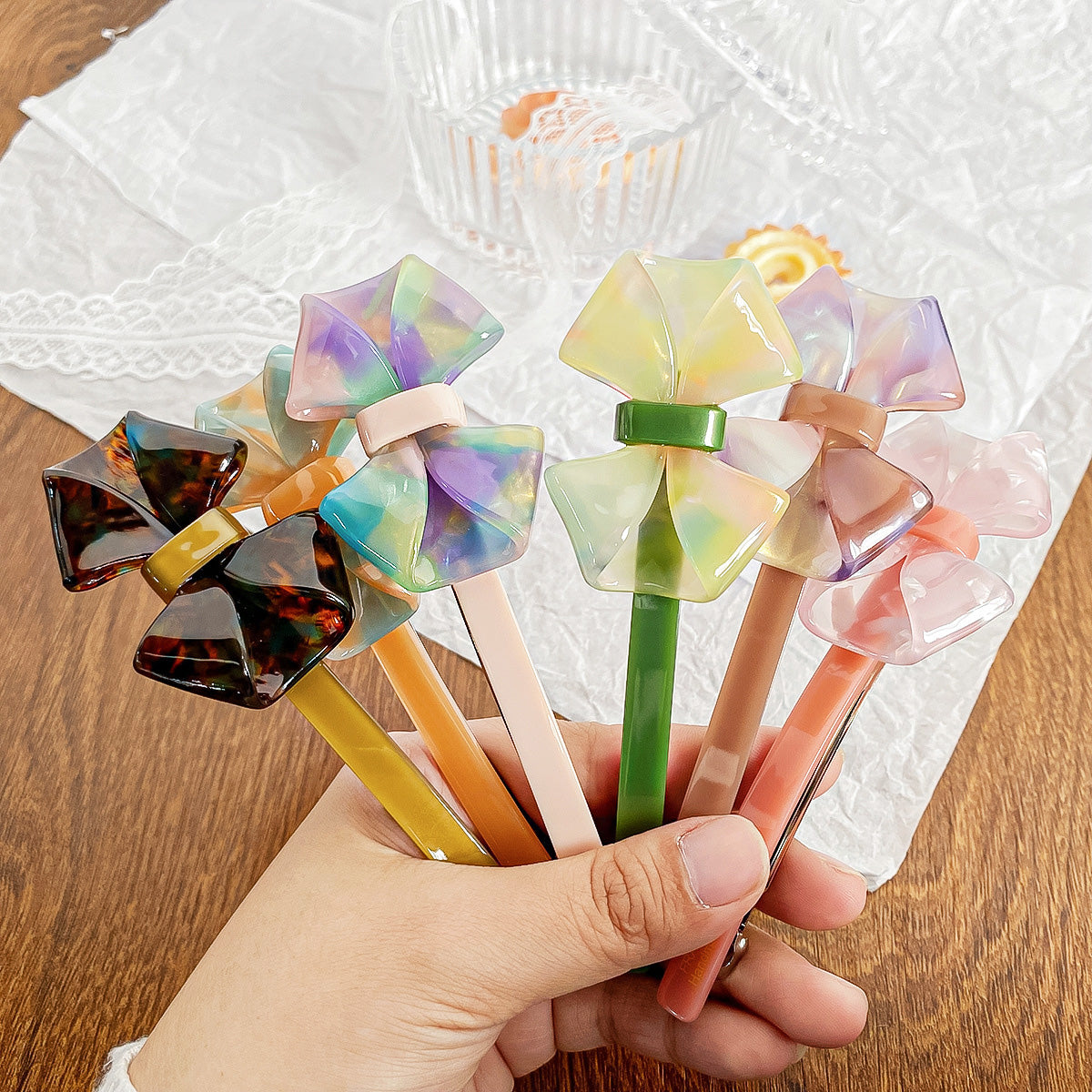 A variety of colorful bow hair clips displayed together