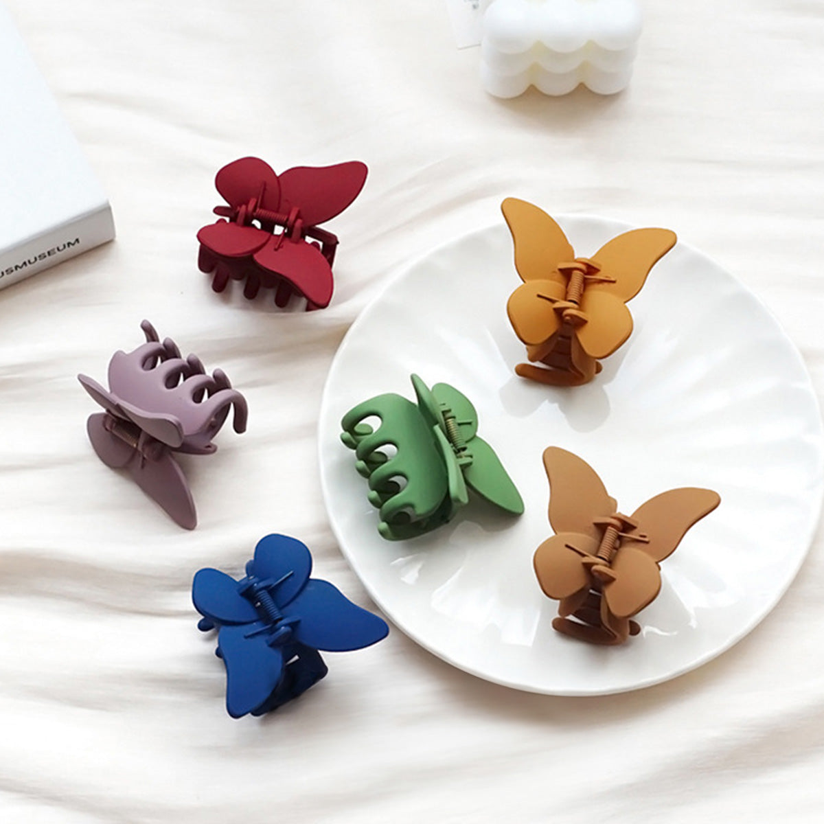 A collection of colorful butterfly hair clips in various shades