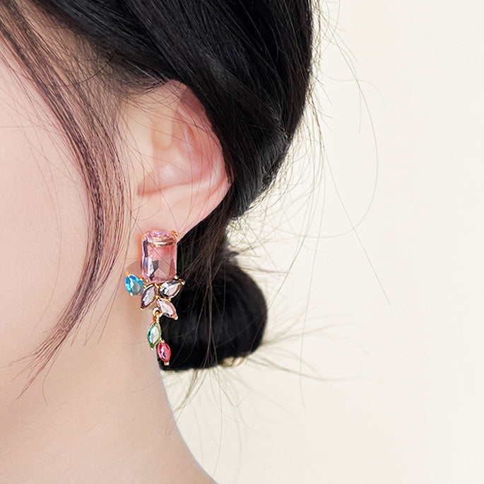 Model showcasing the colorful flower-design zircon earring from the set.