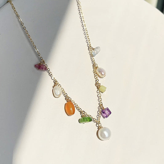 A vibrant costume necklace with colorful gemstones and pearls by JR Fashion Accessories