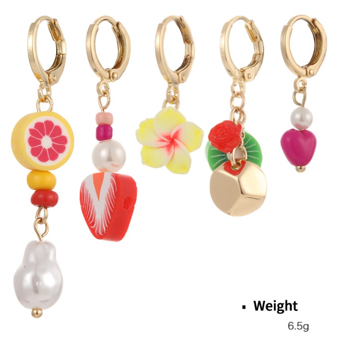 A variety of colorful gold hoop earrings with fruit and flower charms