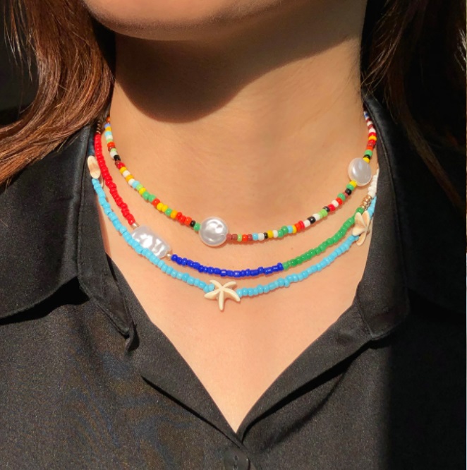 Model wearing the vibrant multi-color seed bead necklace
