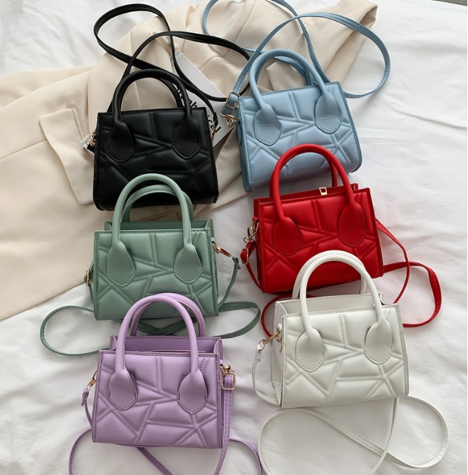 A collection of colorful quilted handbags showcasing customization options