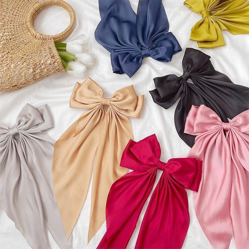 A variety of colorful long-tail bow hair clips