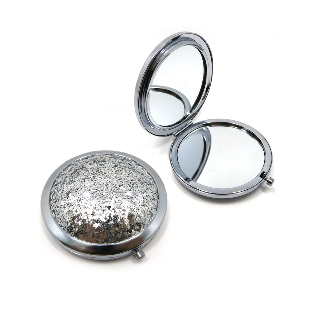 Close-up of the sequin 3D lid on the compact cosmetic mirror