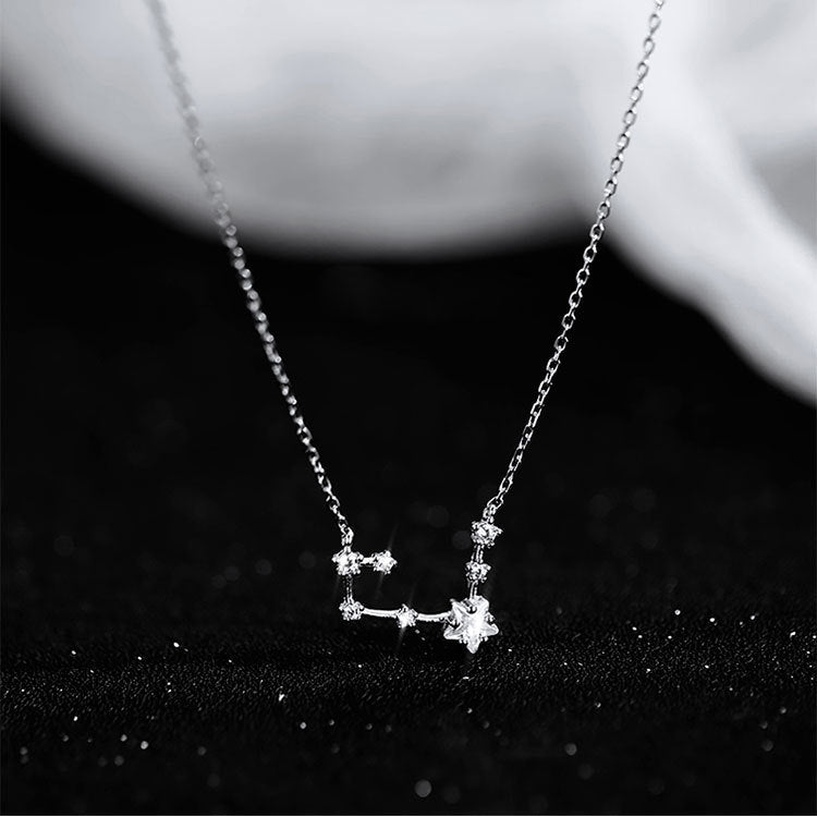 Detailed close-up of the sterling silver constellation pendant