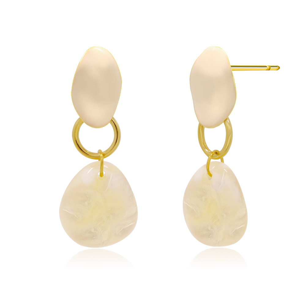 Detailed view of the Bella Dangle Earrings' cream poly/resin and gold finish
