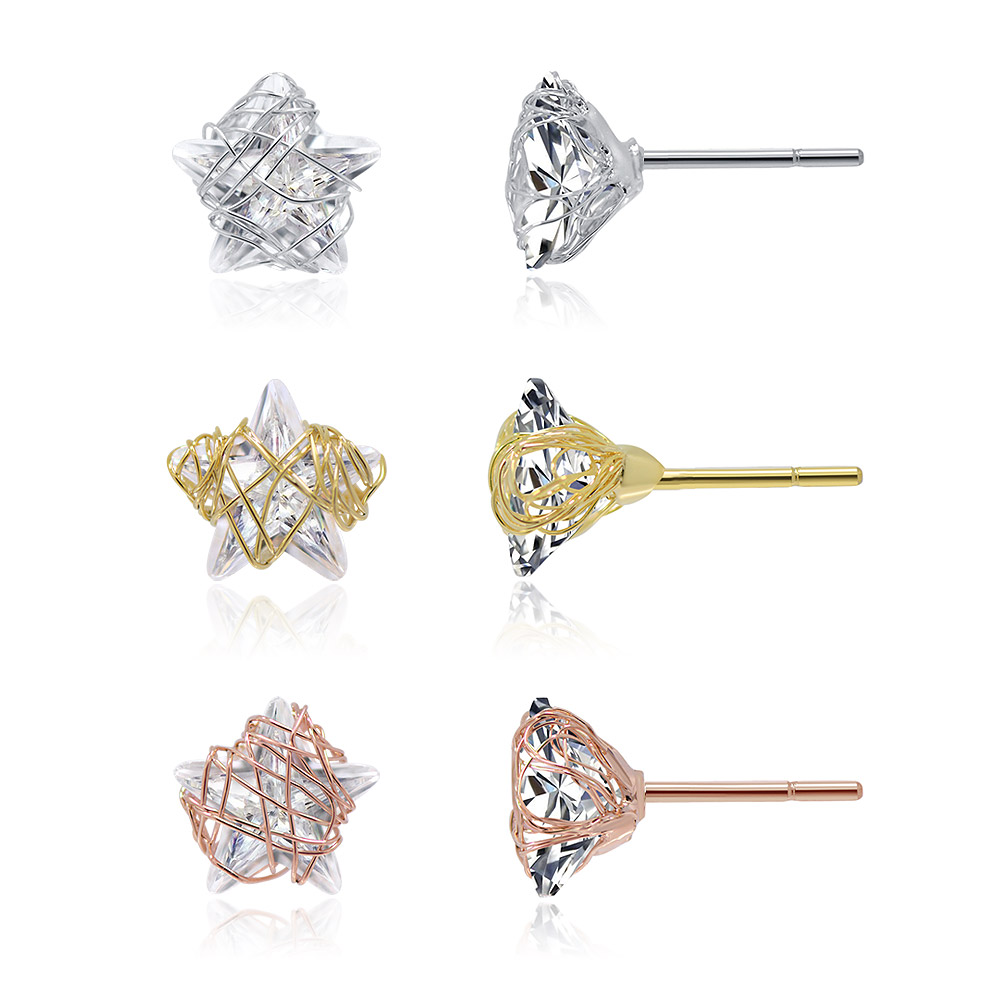 A close-up view of the star-shaped stud earrings in three metallic finishes: silver, gold, and rose gold.