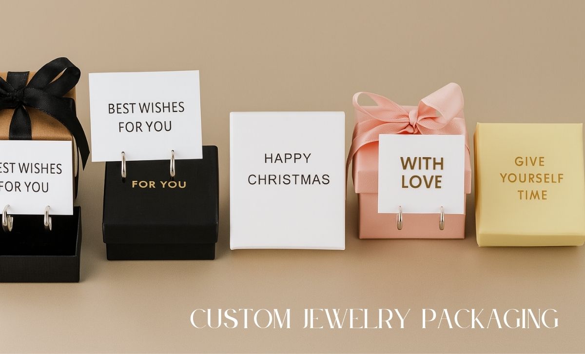 Close-up of hoop earrings with thank-you card, styled for wholesale women's earrings and gifting