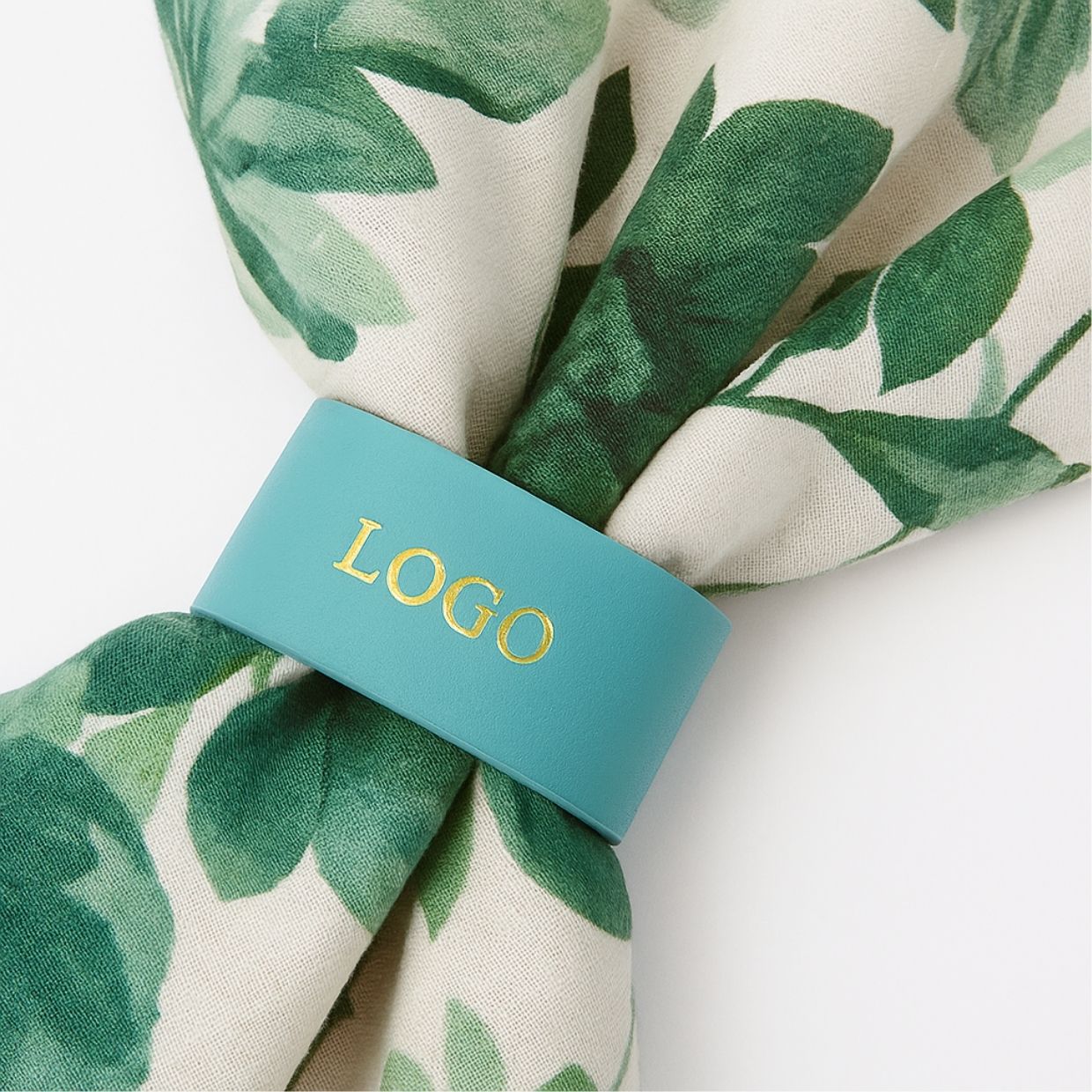 A custom leather band with a debossed logo, demonstrating branding options for napkin rings.