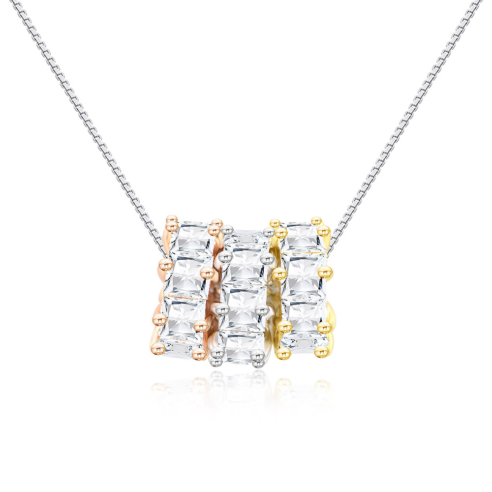 Detailed view of the three-circle pendant with gold, silver, and rose gold tones