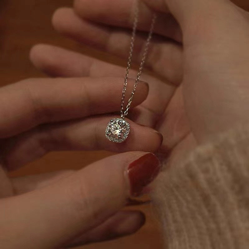 A model wearing the sterling silver square necklace