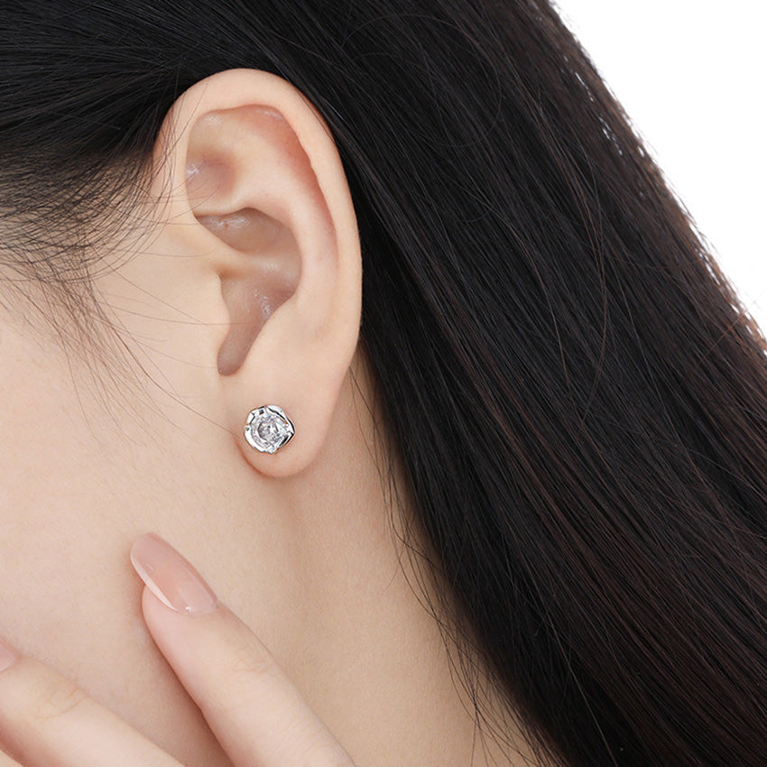 Model wearing the minimalist irregular CZ stud earring to showcase its size and style.