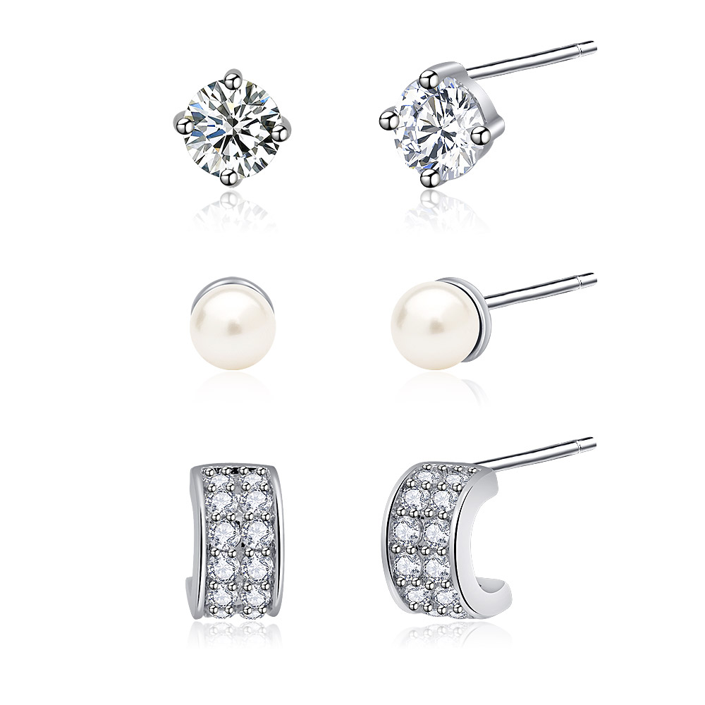 Detailed view of the 3-in-1 stud earring set with CZ and pearl elements