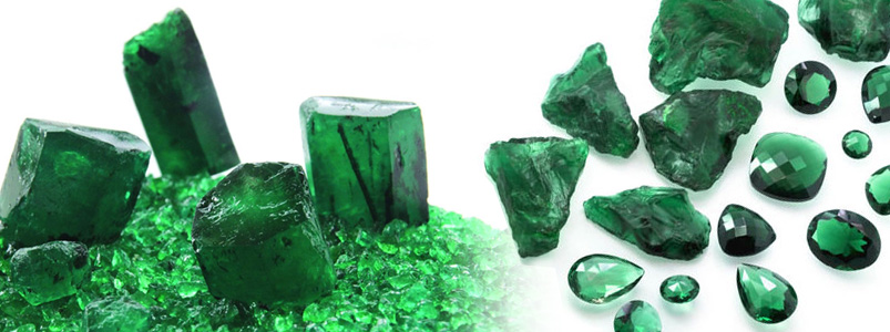 Comparison of rough, natural emeralds and polished, cut emeralds, the May birthstone.