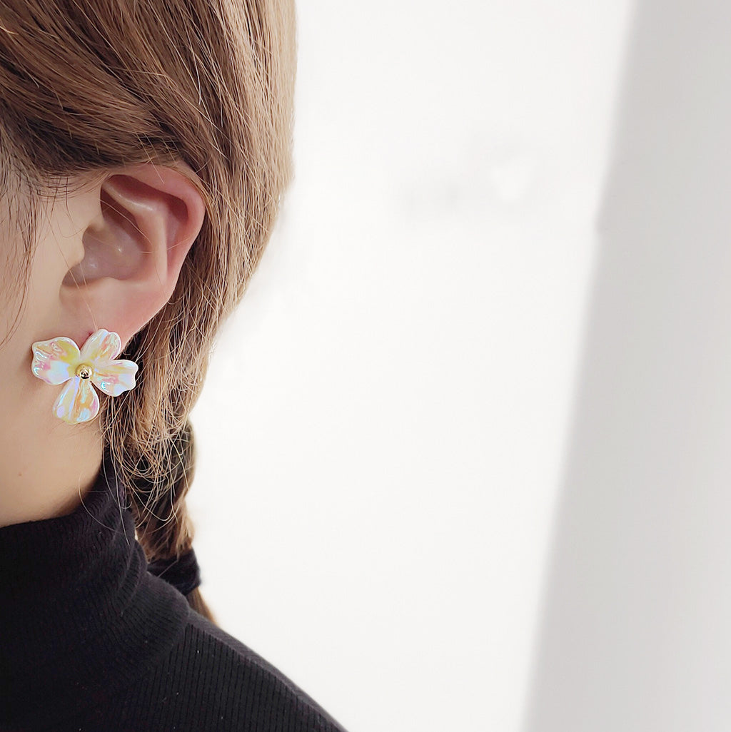 Model showcasing the rainbow effect flower stud earring