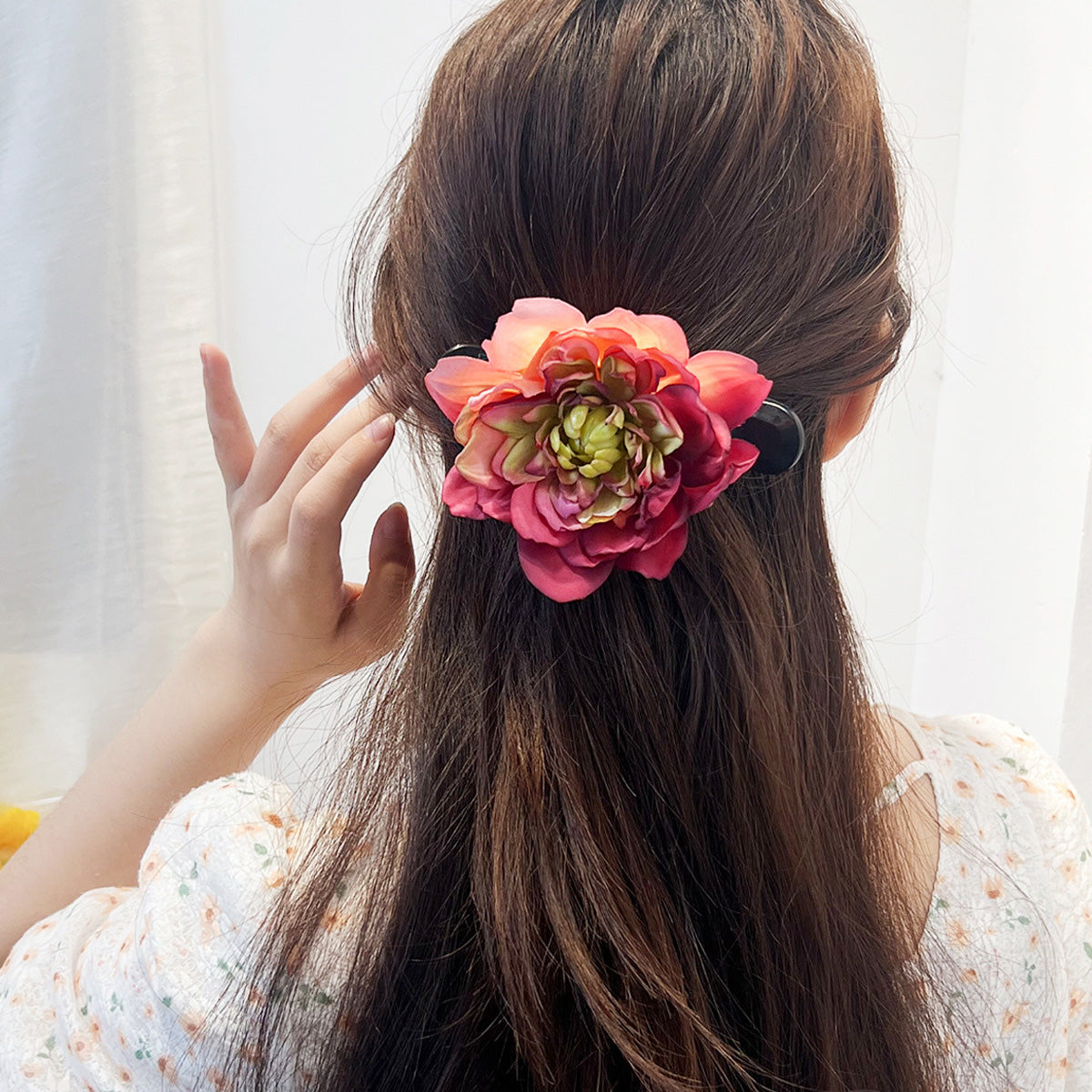 Model showcasing the large floral claw hairclip in her hair