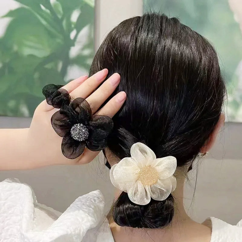 Beige and black organza flower hair scrunchies displayed side-by-side