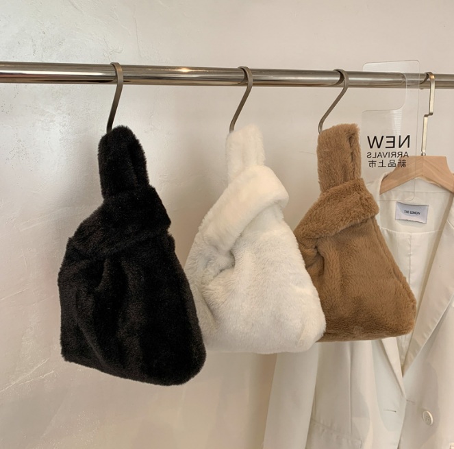 A collection of elegant fuzzy bags in various colors, showcasing new arrivals from JR Fashion Accessories.