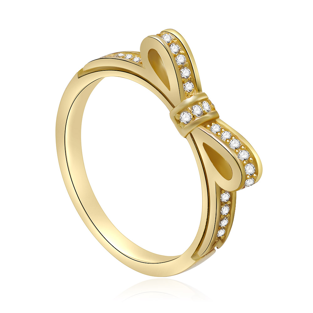 A detailed view of the gold bow knot ring with diamond accents on a white background.