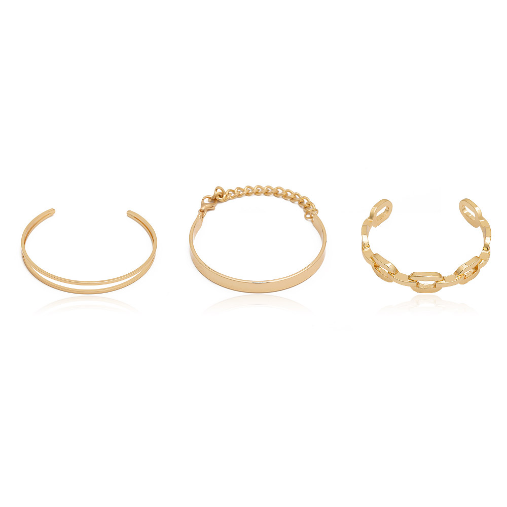 Detailed view of the three unique gold bangle designs
