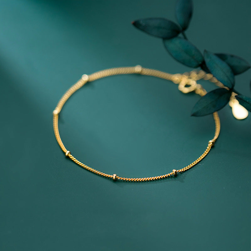 Detailed view of the gold 925 silver beaded bracelet