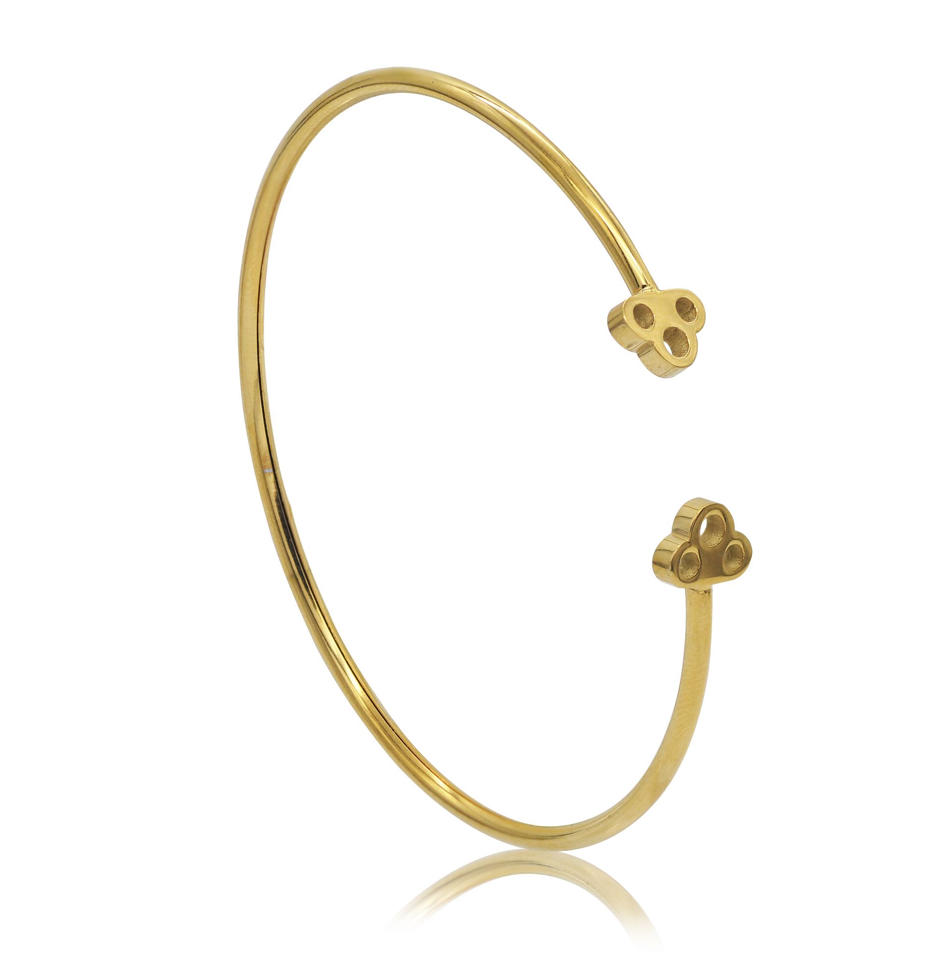 Detailed view of the Dog Paw Open Polished Bangle's decorative ends