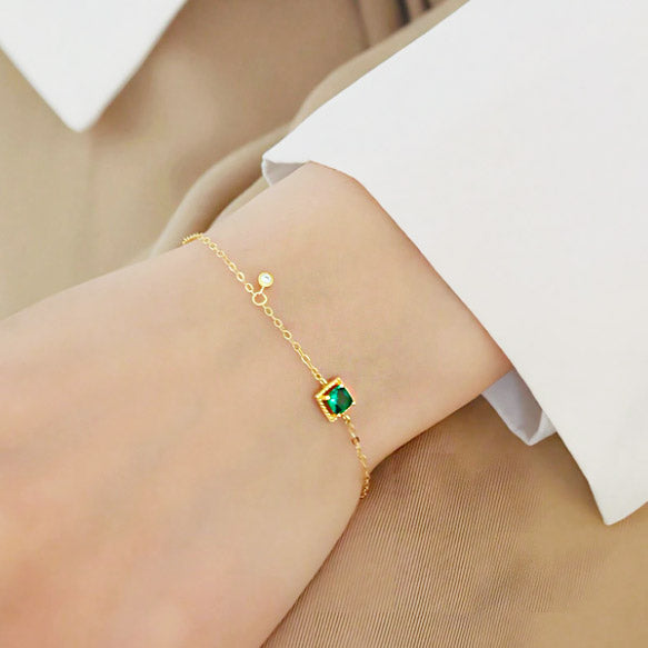 Model wearing the gold-plated green zircon bracelet