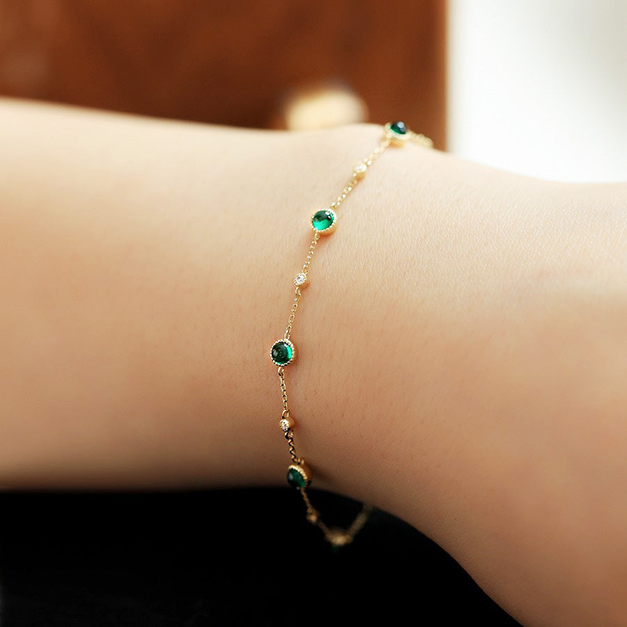 A model wearing the 925 sterling silver emerald zircon bracelet
