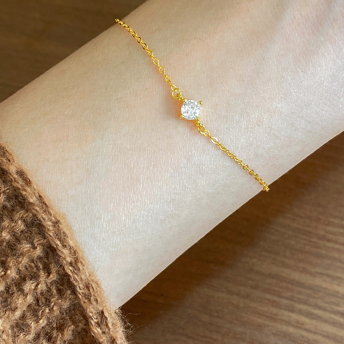 Model wearing the gold single zircon sterling silver bracelet