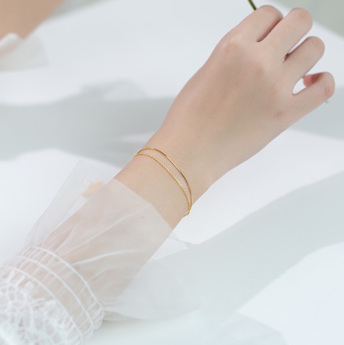Product showcase of the 925 Sterling Silver Gold Plated Double Chain Bracelet on a white background