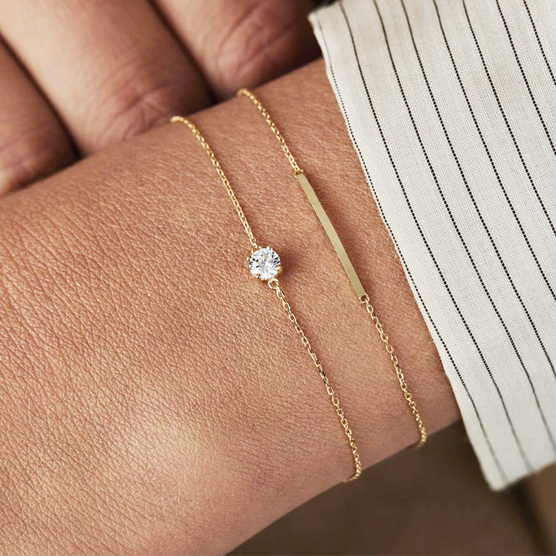 Model showcasing the delicate gold cubic zirconia bracelet on her wrist