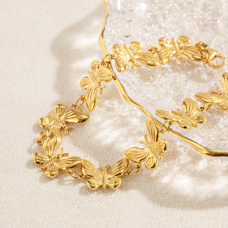 Complete set of stainless steel butterfly bracelets and matching necklace