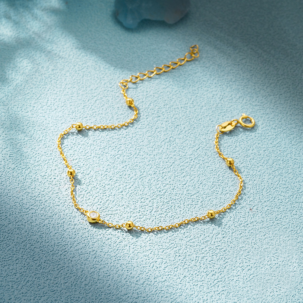 Gold version of the 925 sterling silver bead chain bracelet with zircon stone.