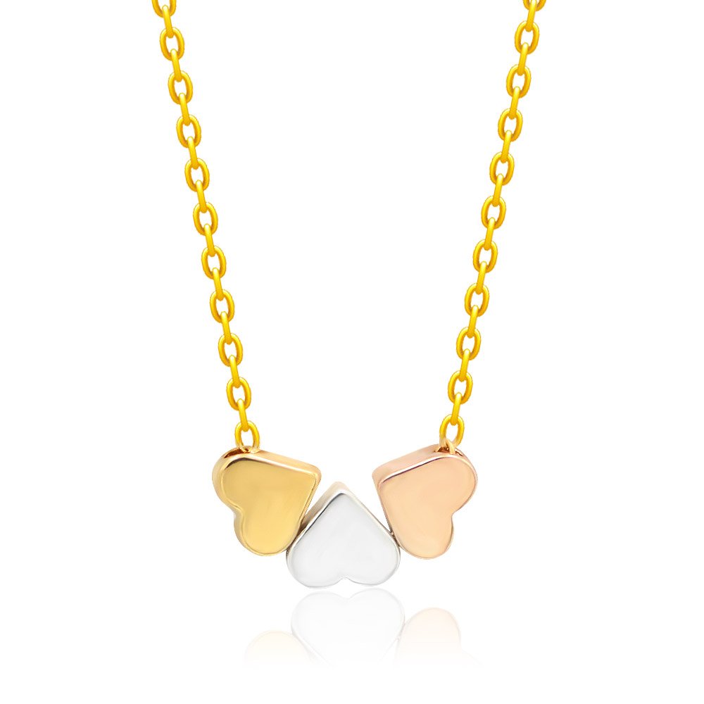 Detailed view of the three-tone heart pendants