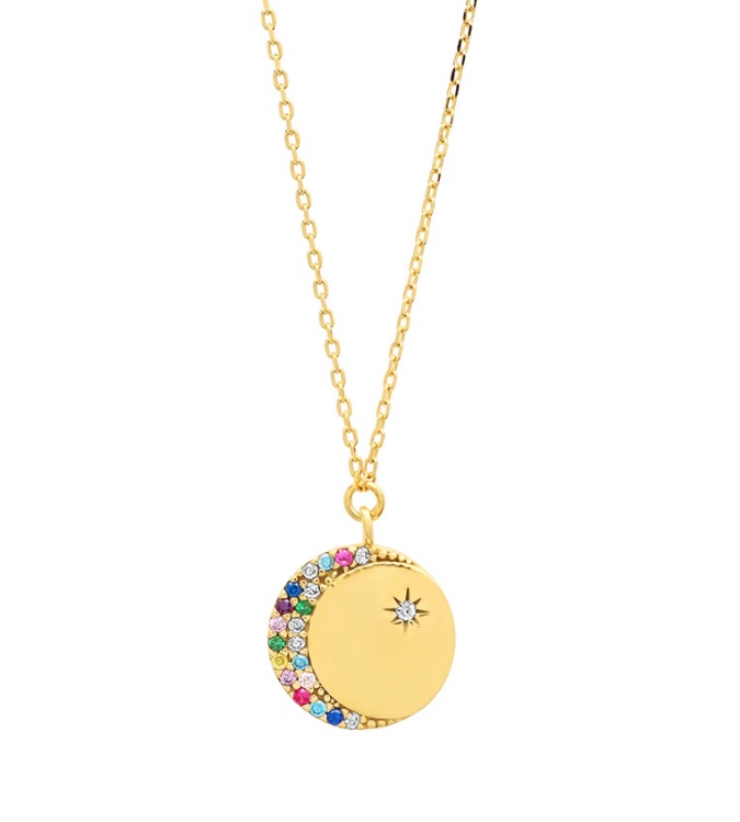 Detailed view of the Cresent Moon Disc Pendant Necklace showcasing the gold plating and cubic zirconia stones.
