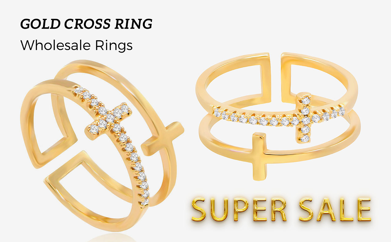 Two gold cross rings displayed for wholesale, highlighting the brilliant cubic zirconia details.