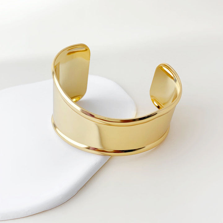 Detailed view of the gold punk cuff bracelet