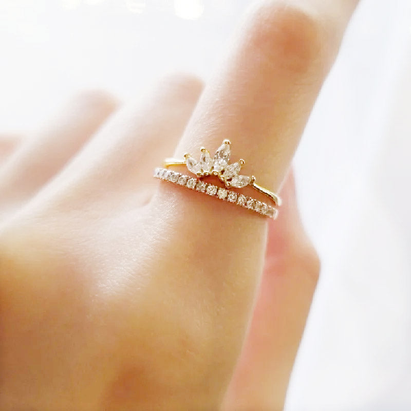 A model wearing the gold flower lotus petal rings to show scale and style.