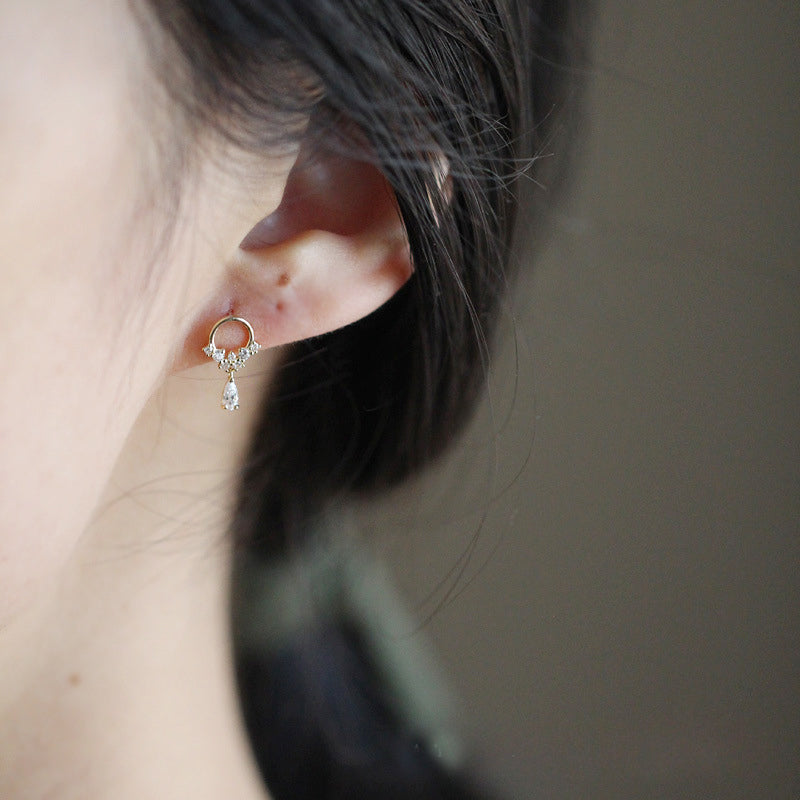 Model wearing the gold zircon teardrop hoop earring